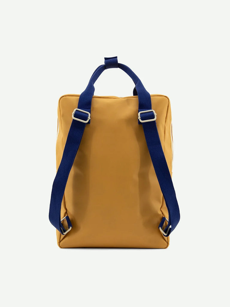 A Camp Yellow Sticky Lemon Backpack Large with contrasting blue straps and silver buckles, isolated on a plain white background.