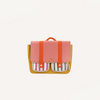 The Sticky Lemon School Bag | Coral Pink + Submarine Yellow is a colorful recycled PET backpack with a pink flap, orange straps, yellow sides, two striped front pockets (pink and black), and a waterproof nylon lining on a white background.