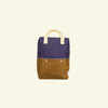 A Sticky Lemon Backpack Large in the "Skate Ramp + Golden Cup" color blocking. It features a purple top half and a brown bottom half, yellow handles, small white buttons in the center of the front, adjustable shoulder straps, and a simple, clean design.
