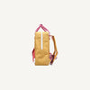 The Sticky Lemon Backpack Medium - Envelope - Apple Grub is a yellow backpack with pink straps and handle, shown side view on a white background. It has a white vertical stripe on the side and features a waterproof lining for protection.