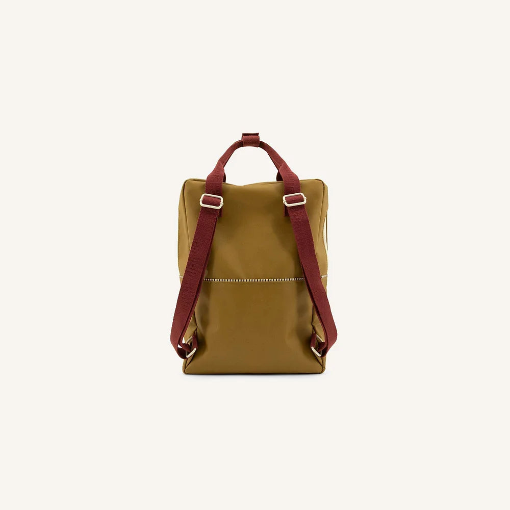 A Sticky Lemon Backpack | Uni | Inventor Green with maroon adjustable straps and a YKK horizontal front zipper, displayed against a plain white background.