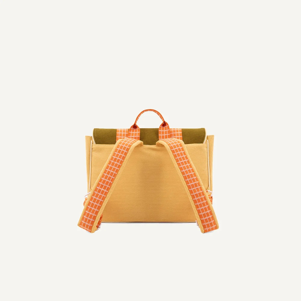 A stylish yellow Sticky Lemon School Bag with unique red and white checked strap accents, against a clean, white background.