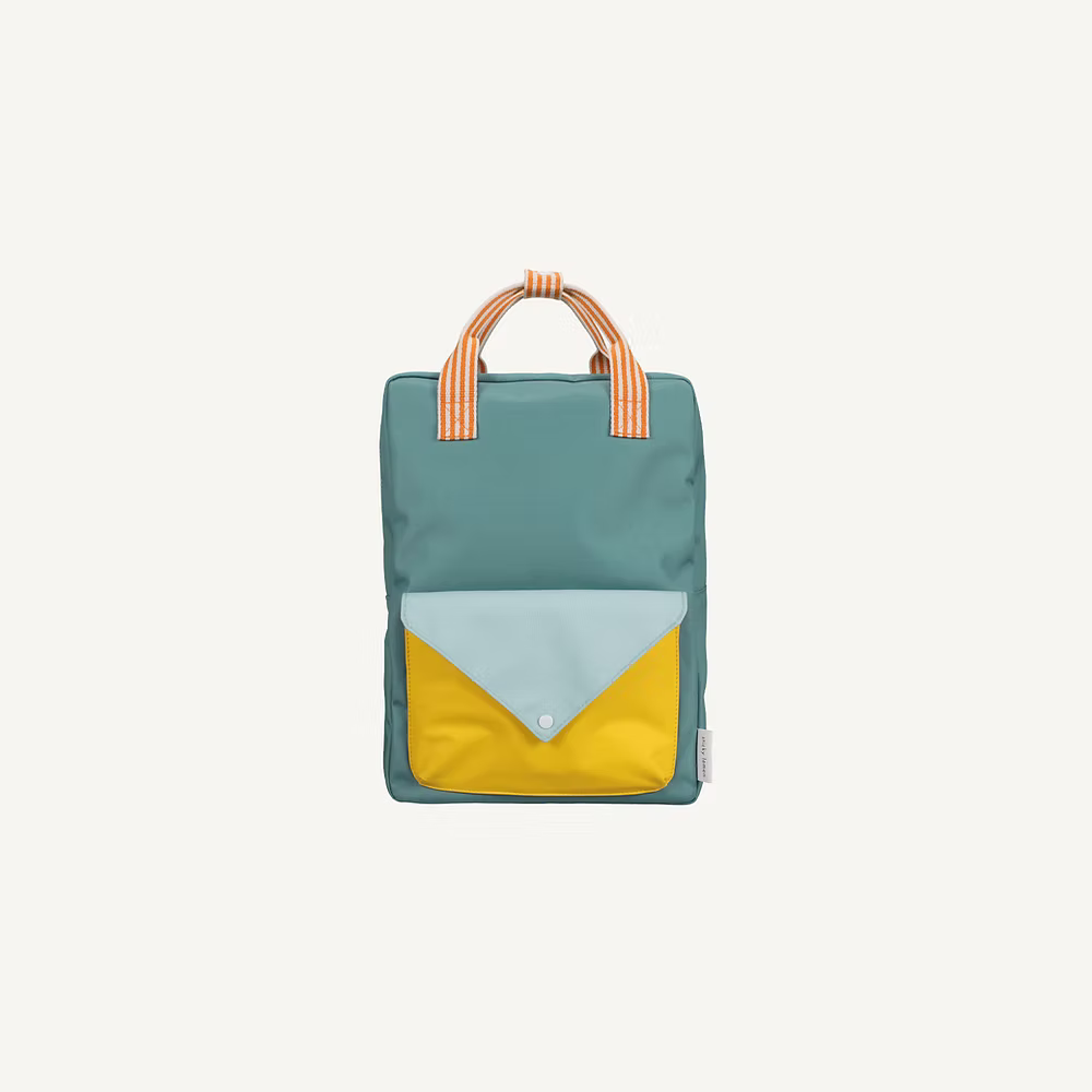 The Sticky Lemon Backpack Large | Envelope | Diving Suit is a rectangular teal kids backpack featuring a yellow and light blue front pocket, orange-and-white striped handles, waterproof lining, and a minimalist design on a white background.