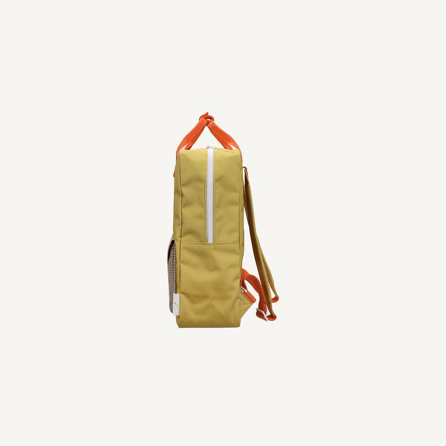 Side view of the Sticky Lemon Backpack Large - Envelope in Bookworm Green, featuring orange straps, a top handle, and a white vertical zipper on a plain light background. This sustainable backpack is waterproof and crafted from recycled PET bottles.