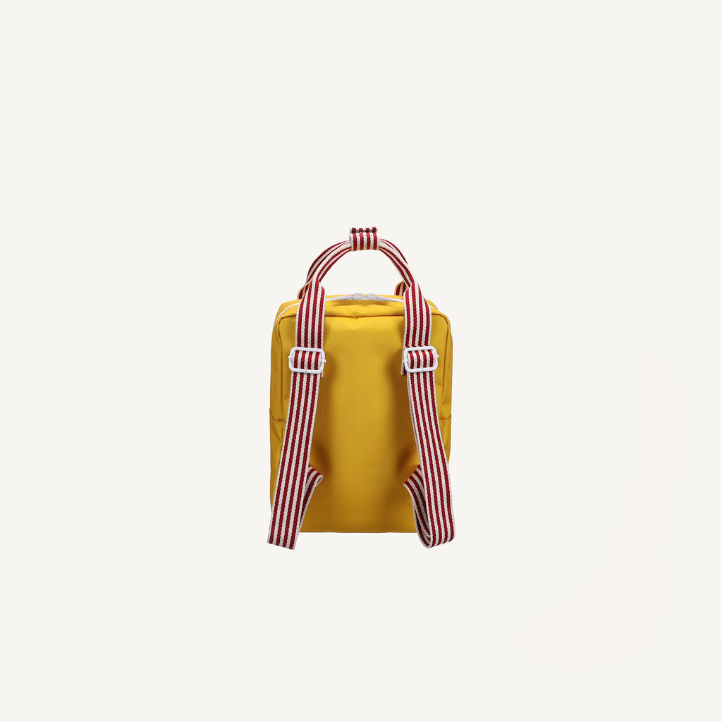 The Sticky Lemon Backpack Small | Envelope Collection in Submarine Yellow is shown from the back, featuring recycled PET material and red-and-white striped adjustable shoulder straps and handle, against a plain white background.