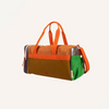 The Sticky Lemon Sports Bag | Better Together features orange handles and strap, a brown front panel, green mesh side pocket, and purple side compartment. Made with waterproof lining from recycled PET bottles. Set against a plain light background.