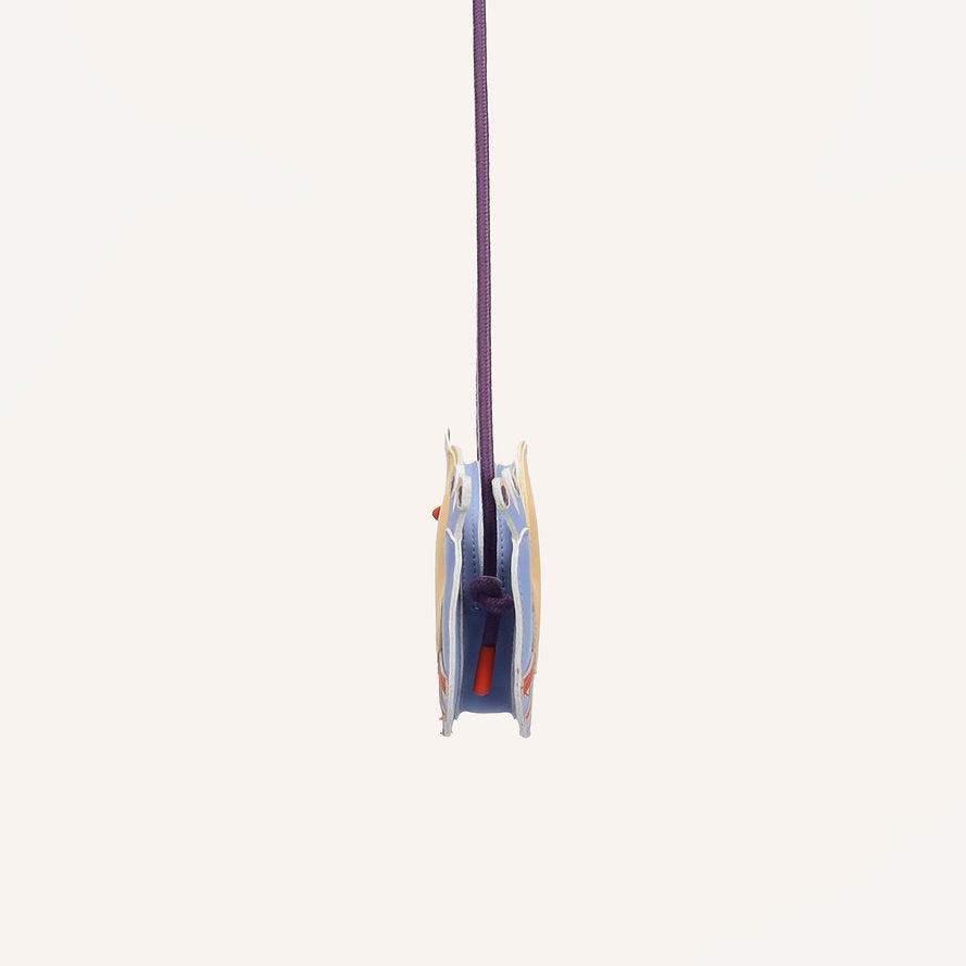 A climbing pulley with a purple rope sits beside the Sticky Lemon Wallet Bag - Snail, both displayed from the side against a plain white background.