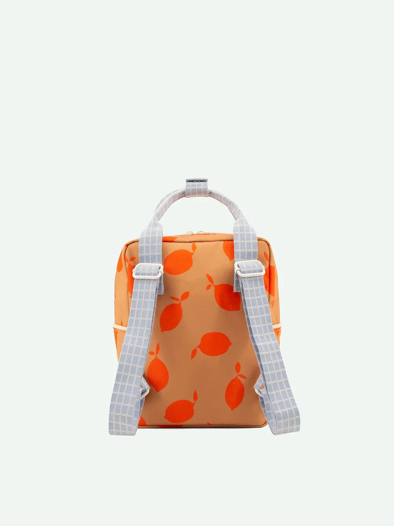 A small, fashionable Sticky Lemon Backpack Small with orange fruit design and light blue checkered straps made from recycled PET bottles, displayed against a plain white background.