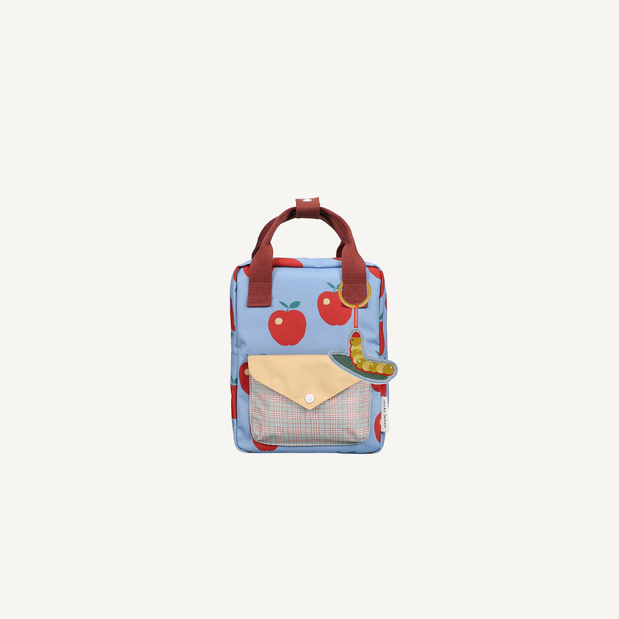The Sticky Lemon Backpack Small - Special Edition - Apple Grub is a blue kids backpack made from recycled PET bottles, featuring red apples, a plaid-flap pocket, red handles, a colorful worm keychain, and waterproof lining.