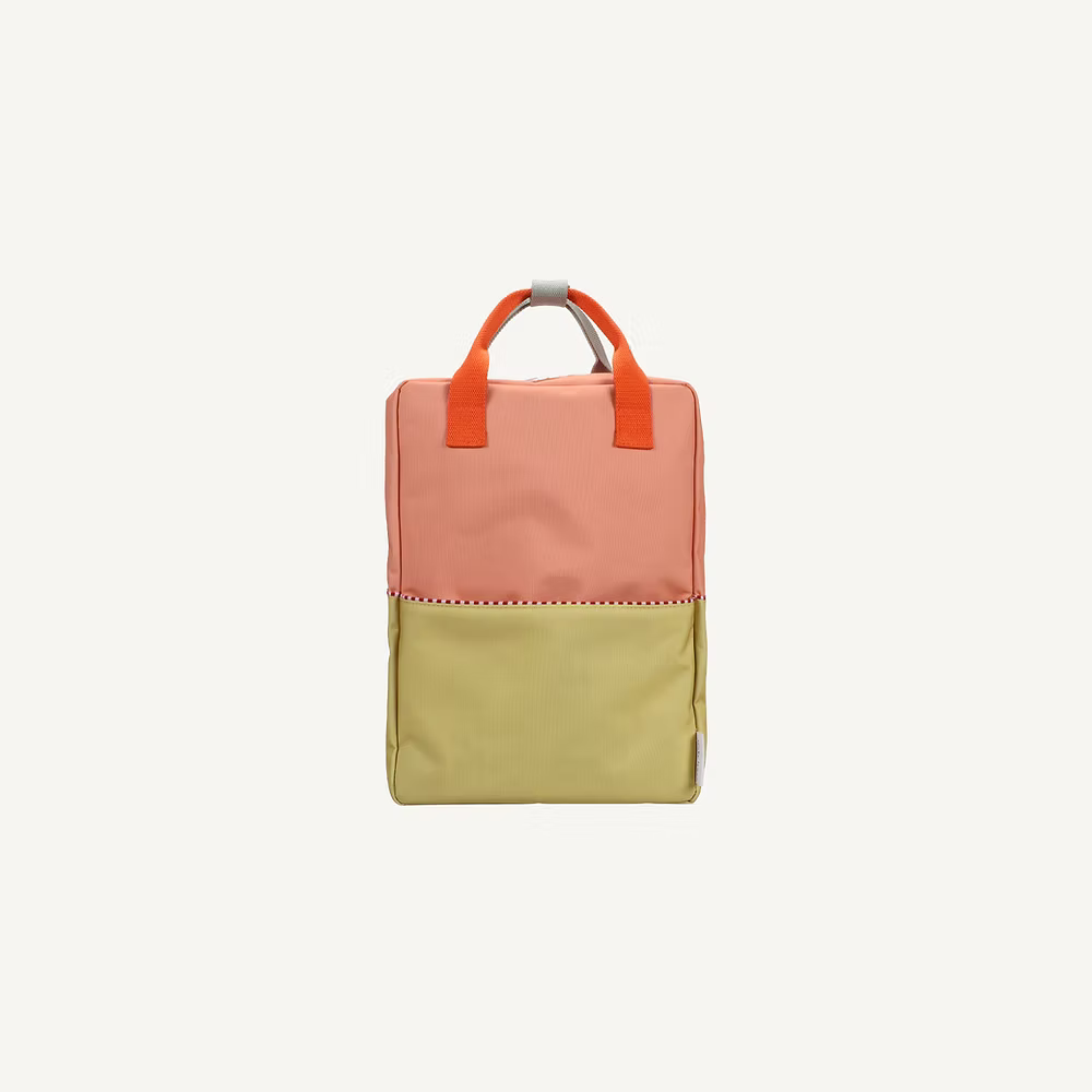 The Sticky Lemon Backpack Large | Color Blocking | Coral Pink + Reed Green features a vibrant color-block design and is crafted from recycled PET bag material.