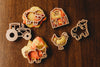 Explore sensory play with our Farm Cutter Set - Eco Playdough Tool, which includes assorted biodegradable cookie cutters and dough shapes featuring a sheep, barn, cow, tractor, chicken, and pig—beautifully arranged on a wooden surface for creative fun.