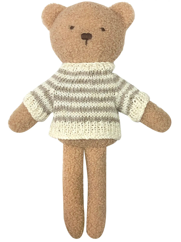 A plush Teddy Bear wearing a striped white and tan polyester cotton sweater, isolated on a white background.