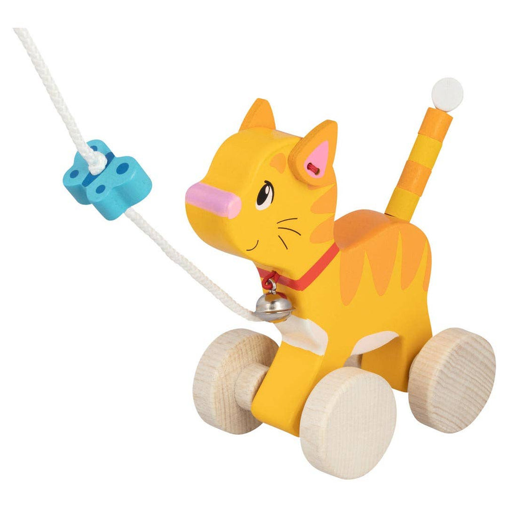 The Holztiger Pull-Along Cat is a charming orange tabby with painted stripes, four wooden wheels, a red collar and bell, and a white pull string with blue beads—perfect for toddlers’ imaginative play.