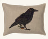 The Coral & Tusk Blackbird with Acorn Pillow showcases an embroidered blackbird next to a potted plant on beige Oeko-Tex certified linen.