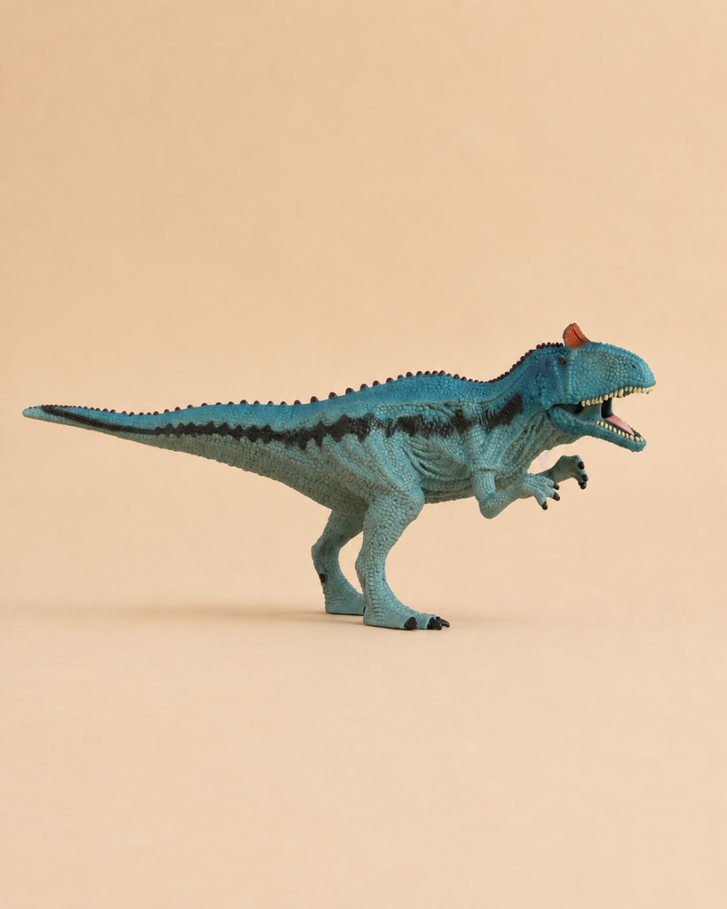 A Schleich Cryolophosaurus Dinosaur Toy with a movable jaw, painted in blue, stands on a beige background with its mouth open and small arms raised.