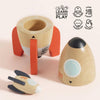 The Magnetic Space Rocket Duo disassembles into three parts: a base with red legs, a middle section, and a nose cone. A small spaceship is included for creative play. Educational icons and text are shown in the upper right corner.