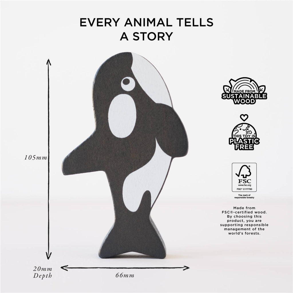 The Ocean Life Stacking Animals & Bag features a wooden orca figure standing upright on a white background. Text above says "Every animal tells a story." Crafted from sustainable wood, it’s plastic-free and labeled with measurements for sensory play.