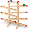 Fagus XL Ball Run toy with a structure of vertical and slanted bars, featuring colored balls (red, yellow, green) poised to roll down the tracks.