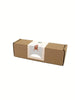 The Sabo Concept Rocket with Bear comes in a small brown rectangular box with a white label featuring a simple brown bear illustration. The sealed box is perfect for imaginative play and rests on a crisp white background.