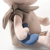 A close-up of the Steiff Harry Potter “Dobby” with Sock 10" plush, featuring Dobby in a textured beige outfit and scarf, holding a small blue sock. The head and lower legs are partially out of frame, capturing this charming collectible.