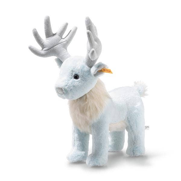 The Steiff Harry Potter "Patronus Stag" 7" plush features light blue fur, large gray antlers, white neck fur, and a small tail, standing upright on all four legs against a white background.