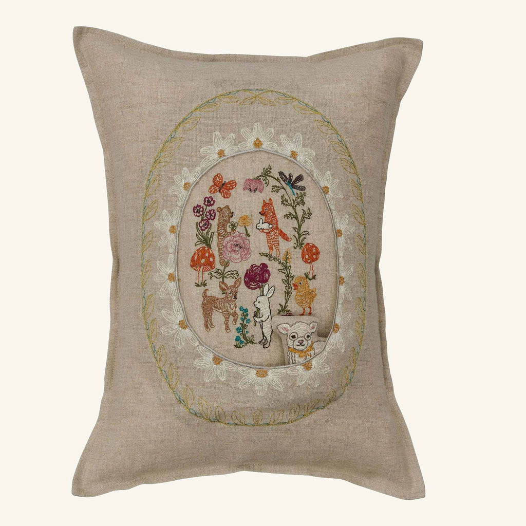 The Coral & Tusk Sugar Egg Pocket Pillow is a beige decorative pillow with colorful embroidered animals, flowers, and mushrooms in an oval floral border—perfect for Easter decor or as a charming Sugar Egg pocket accent.