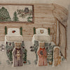 The Coral & Tusk Three Little Bears Pocket Pillow features embroidered art of two bears and a cat in a cozy log cabin, complete with chairs, a window with trees and owl, and side curtain—evoking the charm of Goldilocks' story. Ships in one week.