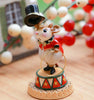 The Wee Forest Folk Tiny Collectible - Gold Rings features a mouse ringmaster on a decorated pedestal with a top hat and ring, holiday berries in the background—a charming collectible figurine.
