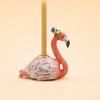 The Flamingo Cake Topper - Final Sale (ships in one week) is a charming ceramic flamingo figurine with a crown, perfect as a collectible birthday keepsake or decorative accent.