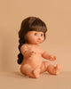A Minikane Doll (13") - Valentine, featuring long brown hair in a braid, sits upright with extended arms and legs against a plain beige background. Clothing sold separately.