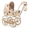 The Konges Sloejd Mini Doll Pram - Strawberry features beige quilted fabric, strawberry embroidery, four large wheels, and a matching hanging bag—an adorable and stylish toy stroller for creative pretend play.