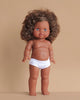 The Minikane Standing Doll (14") - Charlie features brown skin, curly brown hair, and blue eyes, shown upright in white underwear against a plain beige background. Clothing is sold separately. Made in Spain.