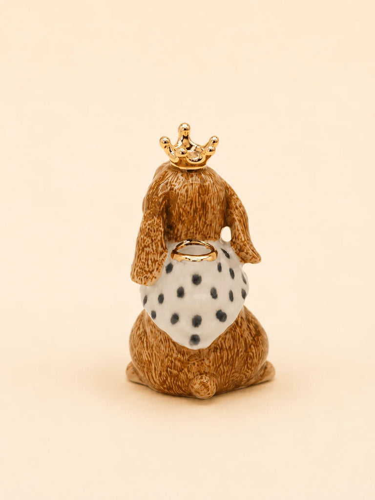 The Highness Hare Cake Topper - Final Sale (ships in one week) features a charming hare with a gold crown and cape, making it a perfect collectible centerpiece for any occasion.