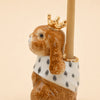 Hand-painted birthday decoration, the Highness Hare Cake Topper - Final Sale (ships in one week) features a gold crown and white cape with black spots—a charming collectible keepsake.