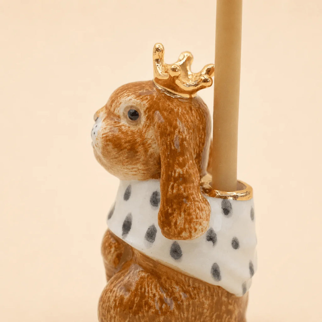 Hand-painted birthday decoration, the Highness Hare Cake Topper - Final Sale (ships in one week) features a gold crown and white cape with black spots—a charming collectible keepsake.