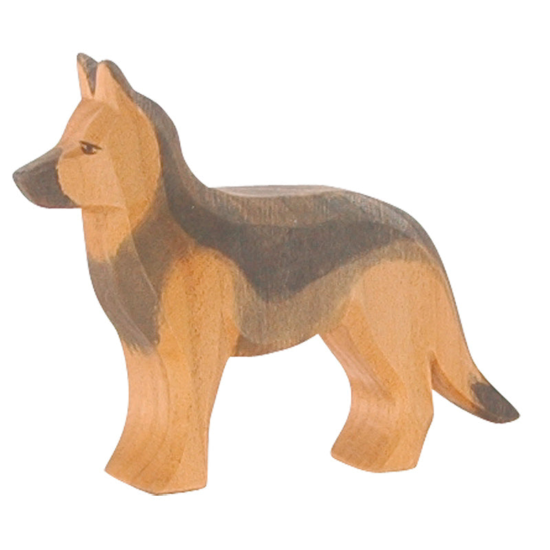 A handcrafted Ostheimer German Shepherd Dog, carved with distinct detailing to highlight its features, standing against a plain background.