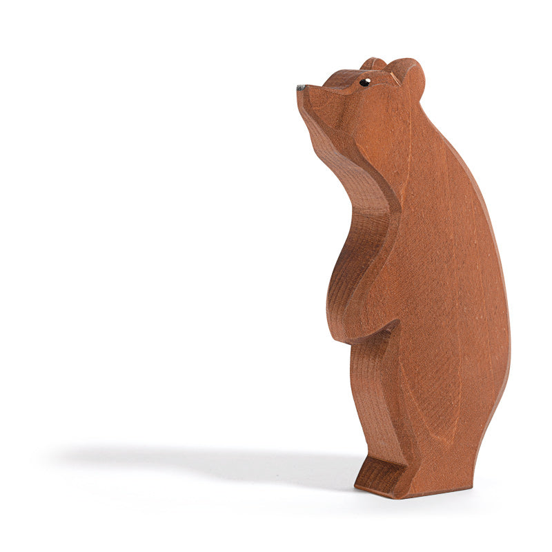 A Ostheimer Large Bear - Standing Head High, carved with smooth, stylized lines and a visibly textured surface, isolated on a white background.