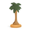 A handcrafted Ostheimer Palm Tree with Stand with a textured green crown and a smooth brown trunk, standing upright on a flat base.