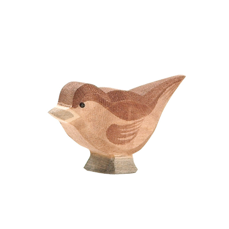 A handcrafted Ostheimer Sparrow figurine with a smooth finish, featuring shades of light and dark brown. The bird is simplified in shape and has a charming, chunky appearance with a small beak.