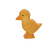 A handcrafted Ostheimer Duckling figurine, painted in yellow and orange tones, shaped in a simplistic style and standing upright on a white background.