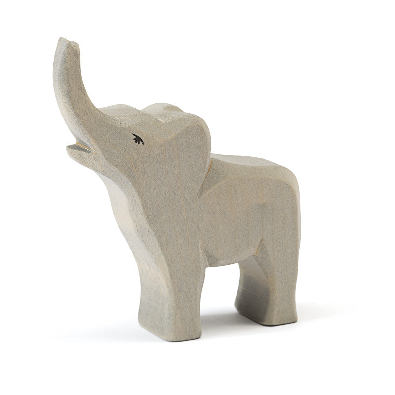 A handcrafted Ostheimer Small Elephant - Trumpeting sculpture with a raised trunk, showing detailed carving and a smooth finish against a white background.