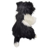 The Border Collie Dog Puppet is a plush, soft-textured black and white toy with a fluffy tail, standing on its hind legs—part of the HANSA animals collection of realistic stuffed animals.