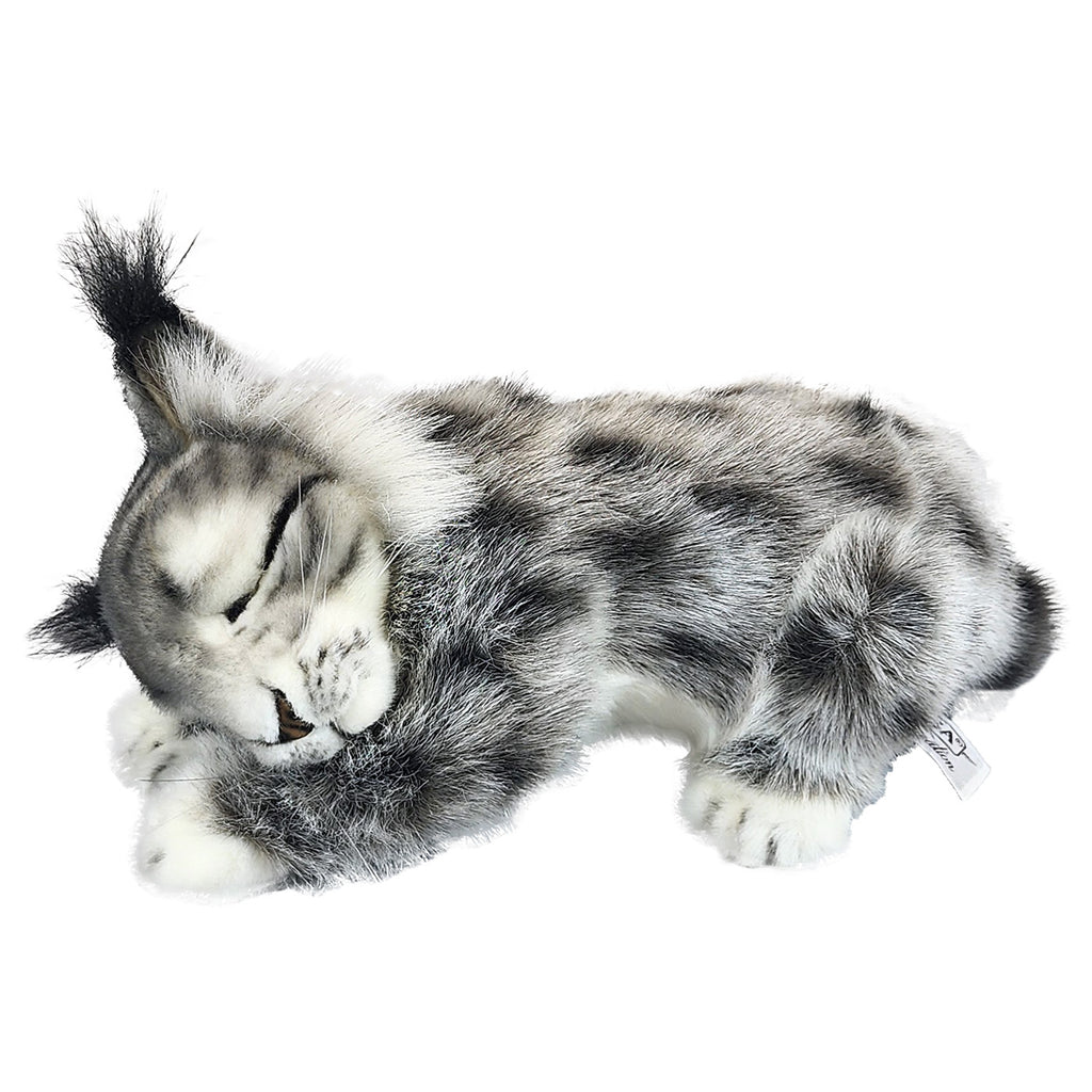 The Baby Lynx Sleeping Stuffed Animal features lifelike gray and white fur and is posed lying down, with one front paw adorably raised to its face as if sleeping. Expertly crafted in the signature style of HANSA animals, this collectible plush showcases exceptional detail and charm for a truly realistic appearance.