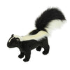 The Skunk Stuffed Animal features black fur, white stripes along its back, and a large bushy tail with a white tip—crafted with care like all HANSA creations.