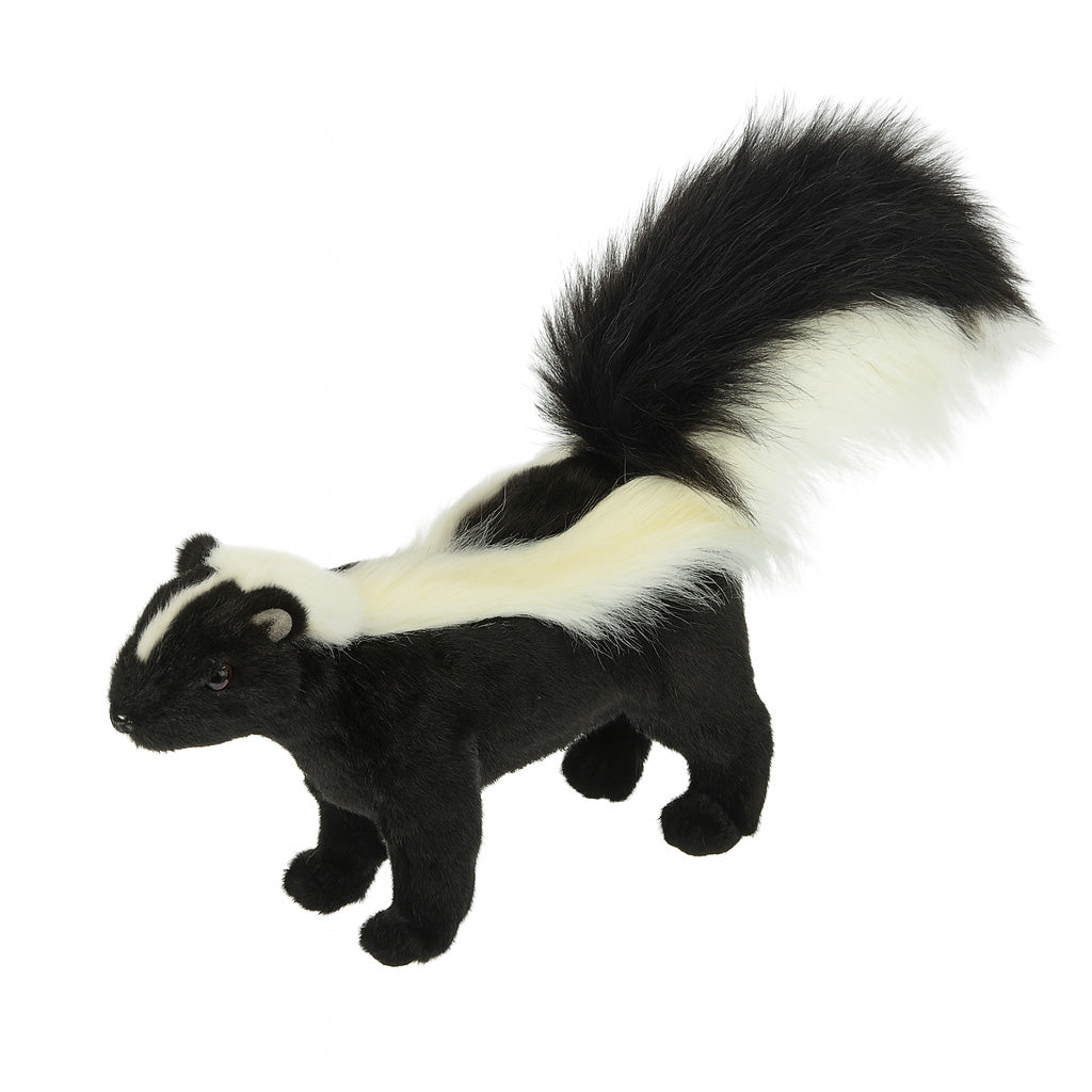 The Skunk Stuffed Animal features black fur, white stripes along its back, and a large bushy tail with a white tip—crafted with care like all HANSA creations.