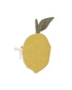 The Konges Sloejd Fabric Lemon Book is a soft, round, yellow pouch shaped like a lemon with a green fabric leaf and beige ribbon, designed as an early sensory toy, shown on a white background.