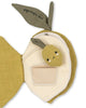 The Konges Sloejd Fabric Lemon Book is a soft, sensory baby book shaped like a lemon with green leaves—one says "squeeze me." It features a smiling plush lemon and a small pocket on a cream-colored background.