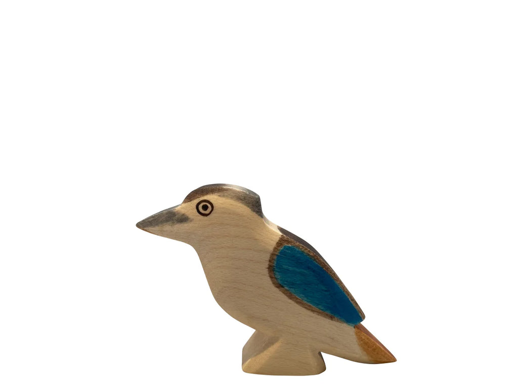 A high-quality Handmade Holzwald Kookaburra Bird figurine with a light beige body and a vibrant blue patch on its wing, standing upright against a plain white background.