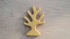 The Handmade Holzwald Yellow Coral is a light wooden toy shaped like a simple tree with five rounded branches, shown on a light wood surface.