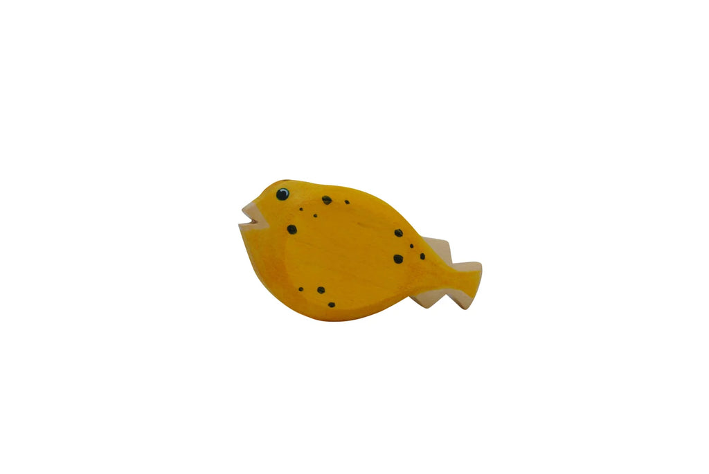 A high-quality Handmade Holzwald Pufferfish toy with a simplistic design, painted yellow with black spots and a visible grain texture, isolated on a white background.